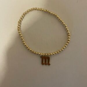 Gold gothic letter M bead stretch bracelet​​​​​